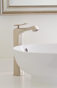 Vessel sinks with brushed nickel faucets.