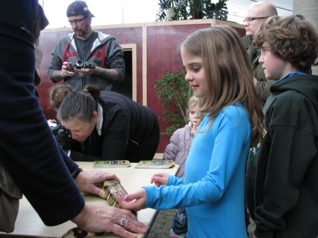 Adley and Elise getting up close and personal with a python