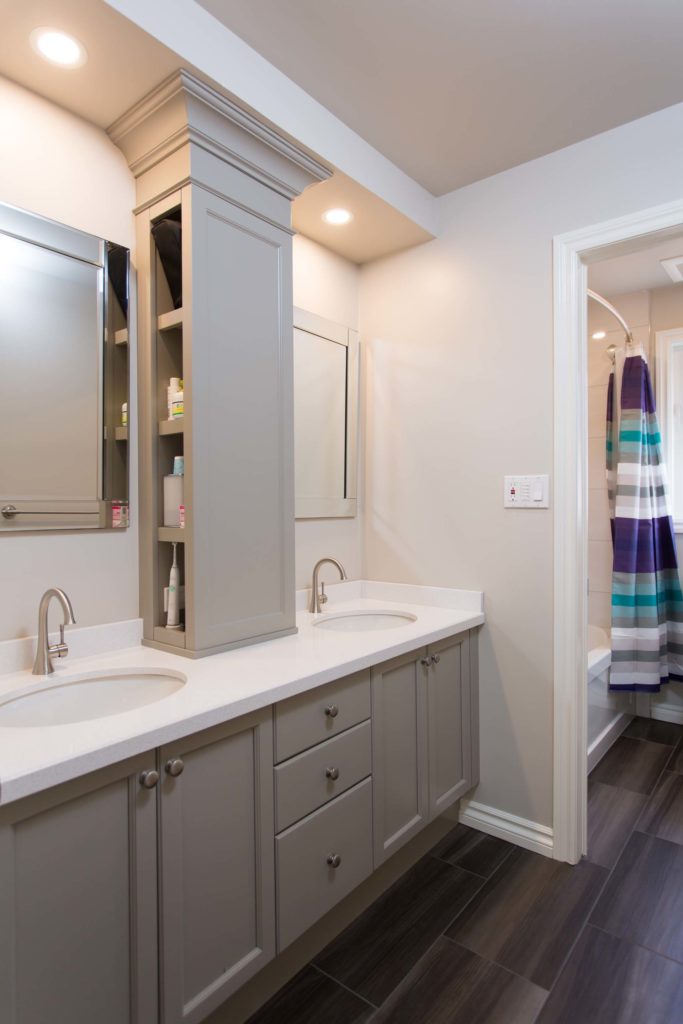 Updated Bathroom with soft Greys and White Quartz Countertop