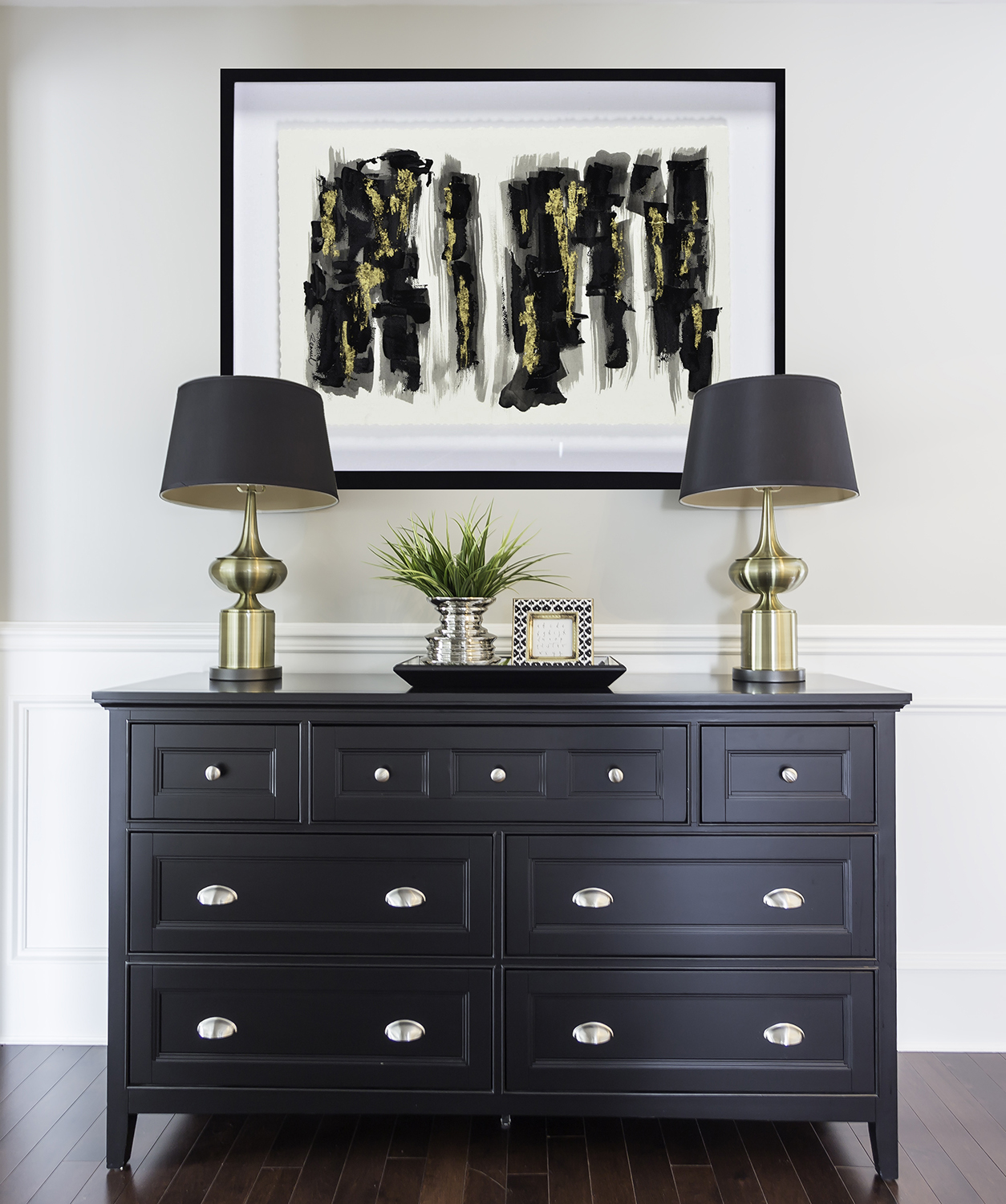 Foyer painted in Stonington Gray with striking black dresser and lamps. 