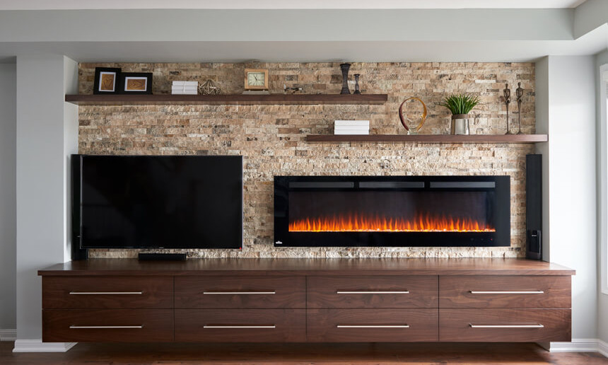 interior-living-room-professional-photograph-with-stone-wall-and-fireplace-with-floating-shelves-and-television-and-lower-custom-cabinetry