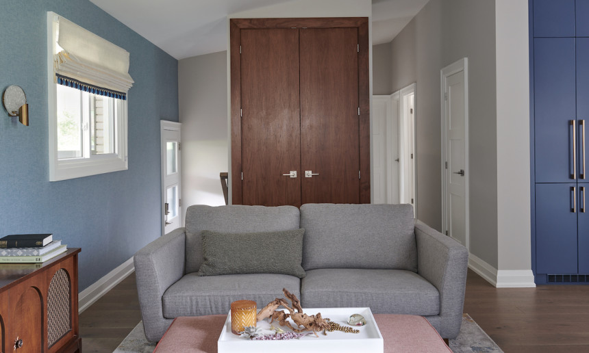 walnut-closet-doors-mid-century-modern-gray-sofa-living-room