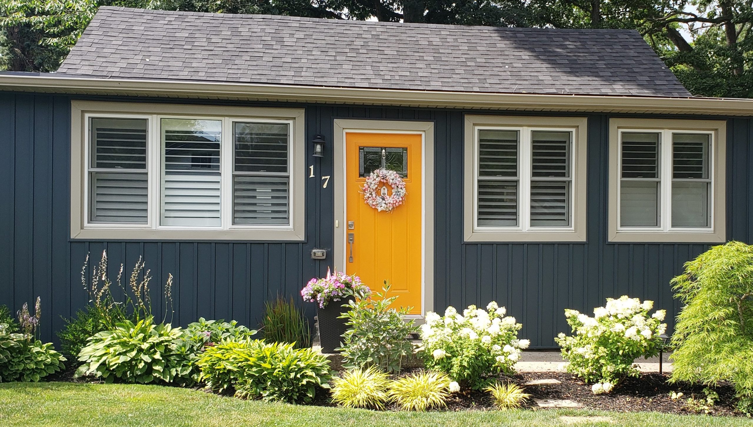 blue house white trim yellow door