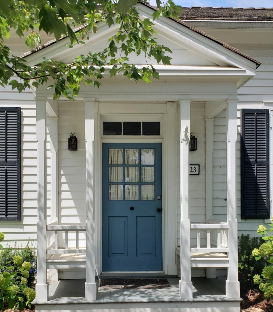 Lucerne Blue Door White Diamond House Black Shutters