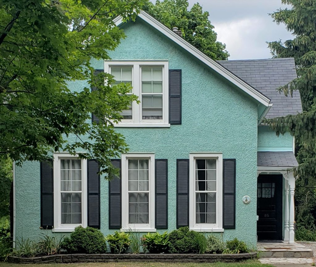 Wedgewood Blue Colour House With Black Door And Black Shutters 1