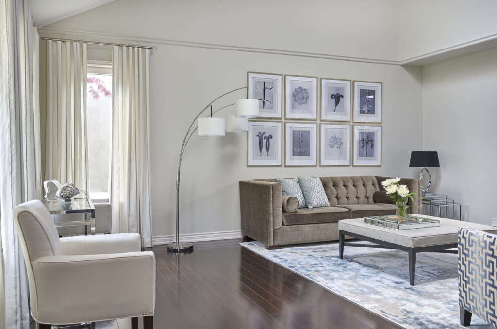 Living Room With Benjamin Moore Classic Gray Walls And Tri Lamp Beside Gallery Art Wall And Classic Sofas