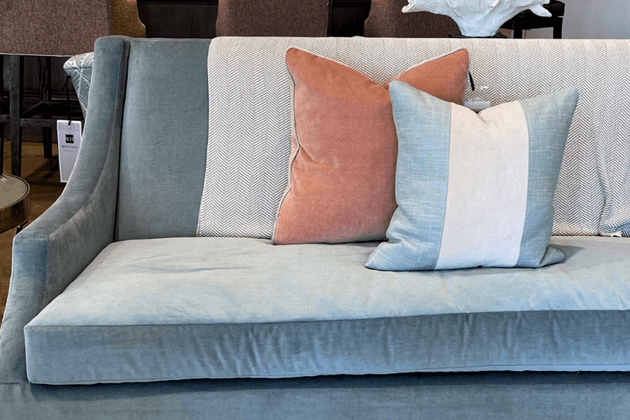 blue velvet sofa, terra cotta pillow
