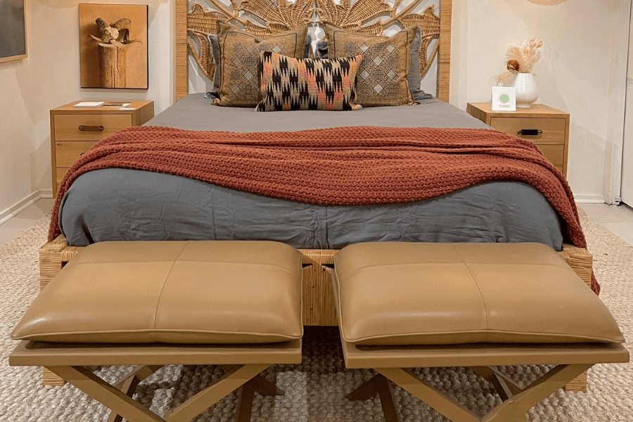 woven decor, wicker, woven chandelier, gray queen bed, wicker headboard, tan leather stools, terra cotta throw