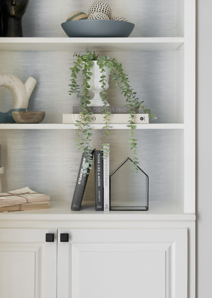 bookshelf-styling-accenssories-white-cabinetry-with-wallpaper
