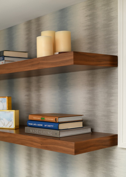 floating-shelves-walnut-finish-wallpapered-accent-wall-blue-and-white