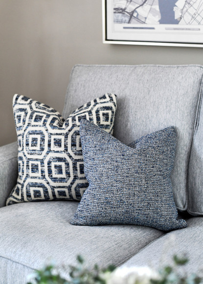 gray-sofa-blue-accent-pillows-netural-wall-color