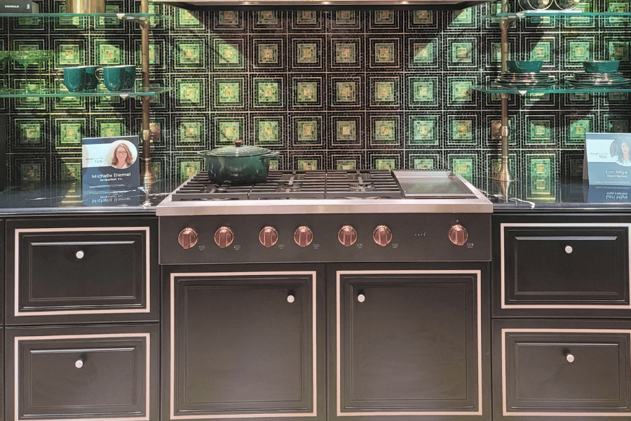 emerald green tole kitchen, dark green cabinetry, glass shelves, gas cooktop