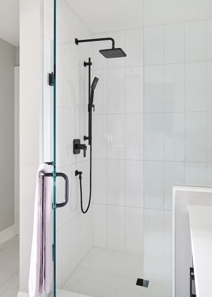 white-shower-tiles-glass-door-black-plumbing-fixtures-rainfall-shower-head
