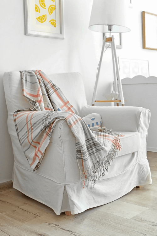 Slip Covered chair, plaid throw
