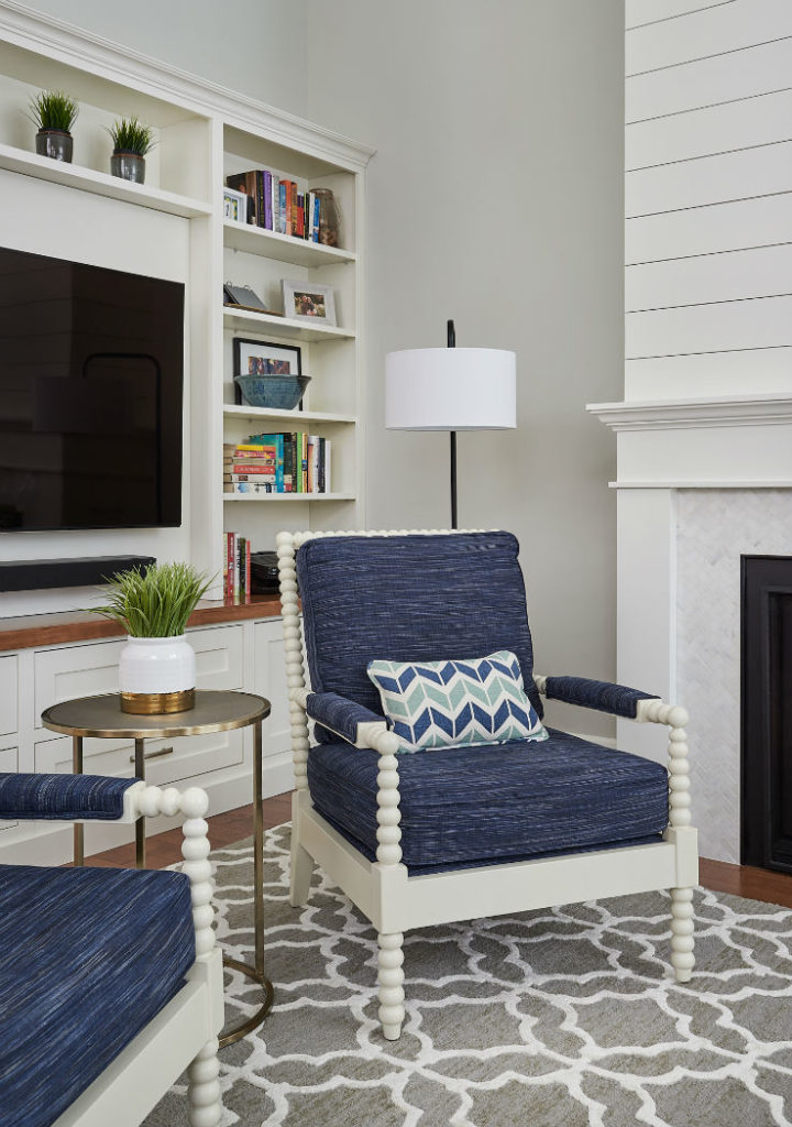Informal Living Room With Custom Upholstered Blue Chair And Ikat Area Rug 