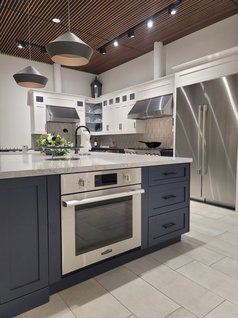 Kitchen Island Built In Stove, Blue Kitchen Cabinets, Grey Countertop, Large Stainless Steel Kitchen Fridge