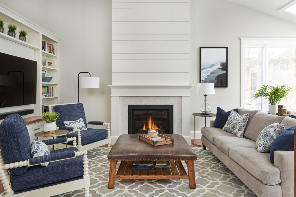 Beautiful Living Room With Shiplap Fireplace Ikat Area Rug Blue Accents And Walls Gray Owl By Benjamin Moore 1