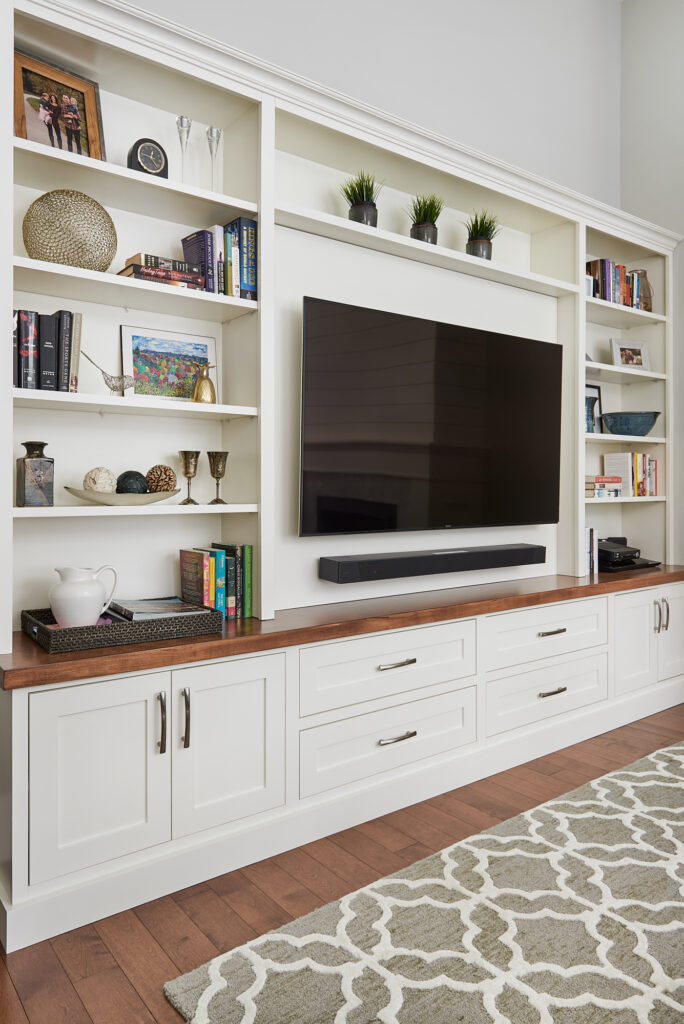 Living Room With Large Custom Built In With Large T.v. 