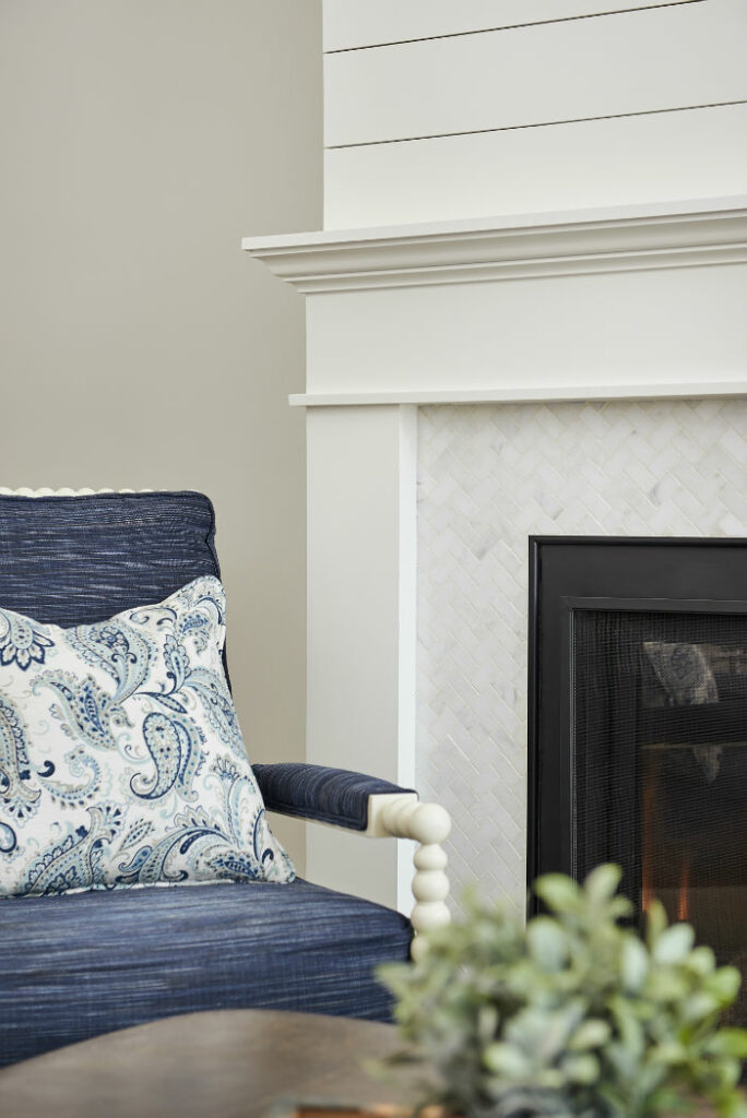 Shiplap Detailed Fireplace With Custom Blue Upholstered Chair Ontario