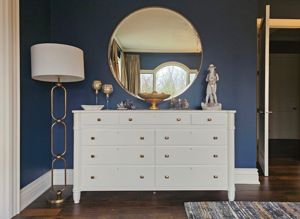 After Cloud White dresser, oversized round mirror and gold floor lamp, and curated accessories in Burlington bedroom redesign by clairejefford.